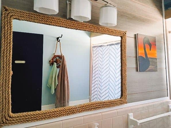 I spent under $35 to make this DIY nautical rope mirror decor for one of my bathrooms. And besides already having the mirror to do this - the project was super easy. Finding the twine rope was difficult, mainly because I was picky - I wanted a thick, distressed and natural looking twine (not some poly-blend type rope, which is all I was finding).